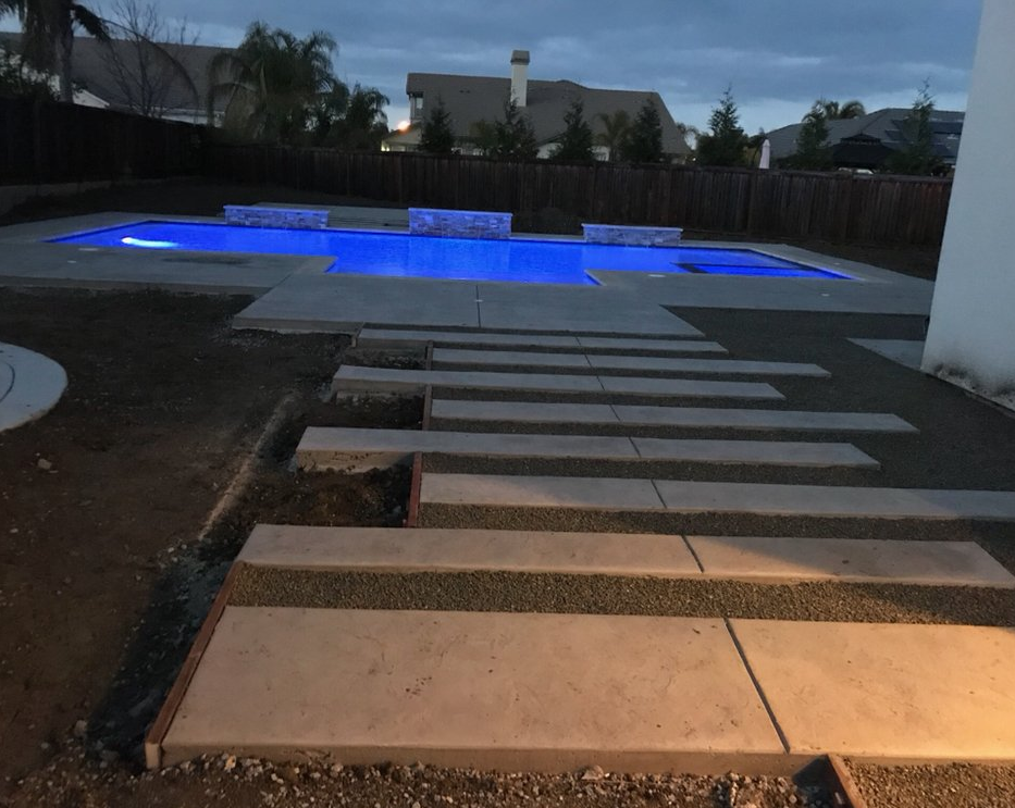 The photo shows the finished concrete slab work in Aliso Viejo.